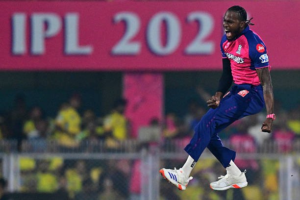 TOPSHOT - Rajasthan Royals' Jofra Archer celebrates after taking the wicket of Chennai Super Kings' Rachin Ravindra during the Indian Premier League 