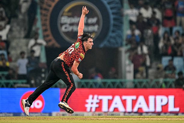 Sunrisers Hyderabad's captain Pat Cummins bowls during the Indian Premier League (IPL) Twenty20 cricket match between Royal Challengers Bengaluru and Sunrisers Hyderabad at the Ekana Cricket Stadium in Lucknow on May 23, 2025.