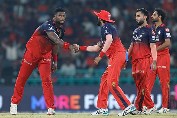 LUCKNOW, INDIA - MAY 23: Romario Shepherd of Royal Challengers Bengaluru celebrates the wicket of Nitish Kumar Reddy of Sunrisers Hyderabad during the 2025 IPL match between Royal Challengers Bengaluru and Sunrisers Hyderabad at Bharat Ratna Shri Atal Bihari Vajpayee Ekana Cricket Stadium