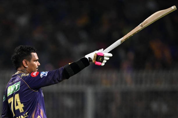 Kolkata Knight Riders' Sunil Narine celebrates after scoring a century (100 runs) during the Indian Premier League (IPL) Twenty20 cricket match between Kolkata Knight Riders and Rajasthan Royals at the Eden Gardens in Kolkata