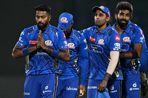 Mumbai Indians' captain Hardik Pandya (L) along with his teammates, walks back to the pavilion after their win at the end of the Indian Premier League (IPL) Twenty20 cricket match between Delhi Capitals and Mumbai Indians at the Arun Jaitley Stadium in New Delhi o